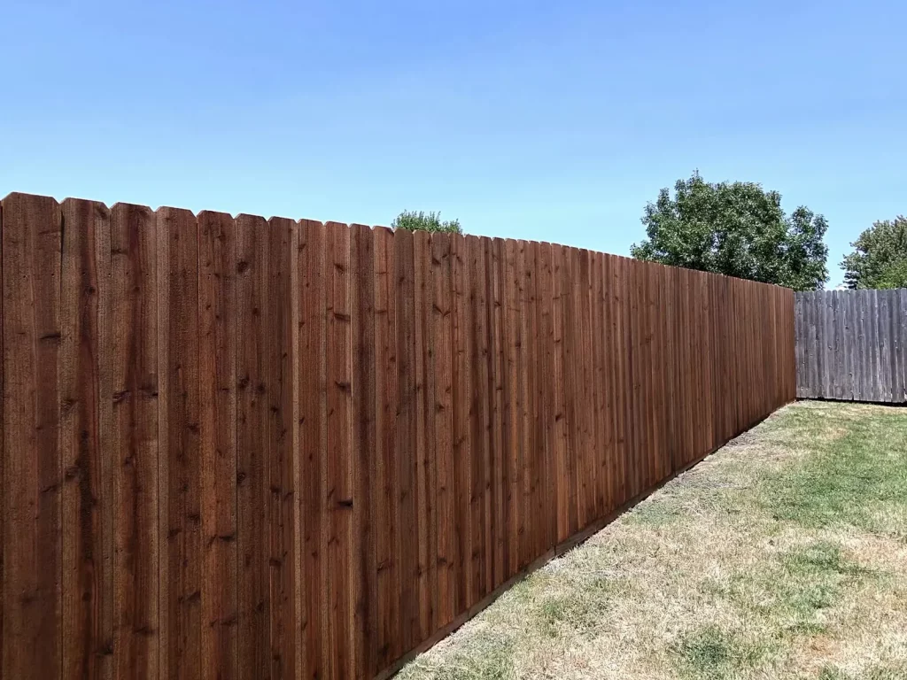 70 linear feet of stained cedar privacy fence running the property line in Arlington, TX