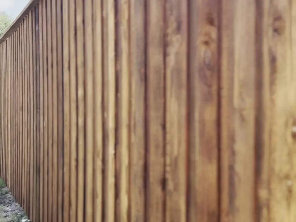 8 ft board on board fence in Fort Worth, TX showing the overlapping cedar pickets and cap trim
