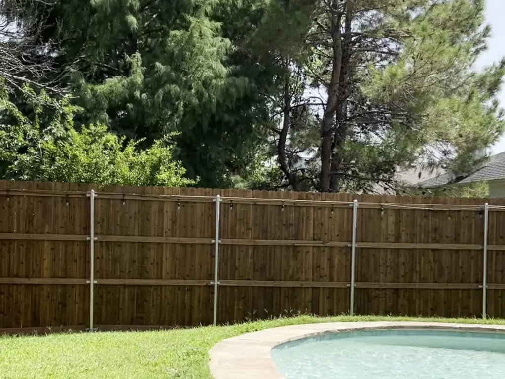 8 ft cedar privacy fence running along a property line in Arlington, TX