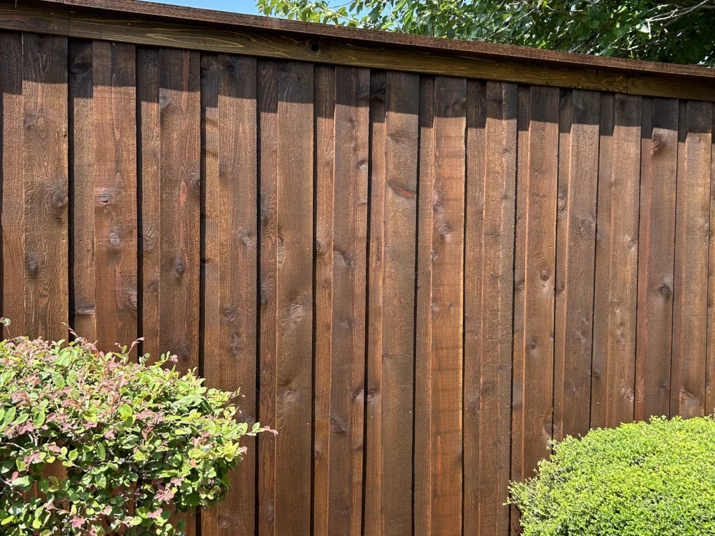 Close view of the cedar cap and trim finishing the top of an 8 ft cedar fence in Mansfield, TX