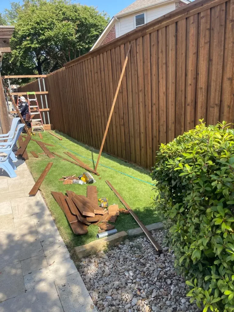 8 ft cedar fence installation in progress in Frisco, TX with pickets being fitted