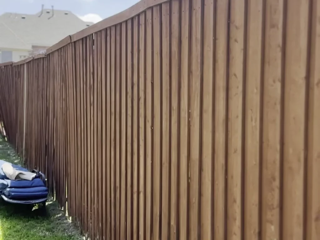 Old wood fence with daylight gaps between every picket before cedar fence replacement in Murphy, TX