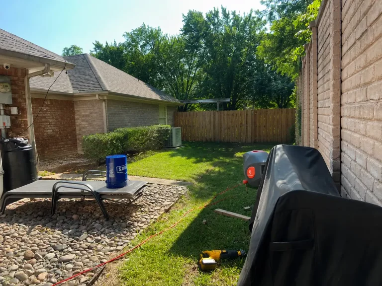 Open side yard beside a patio in Bedford, TX before the cedar privacy screen was built
