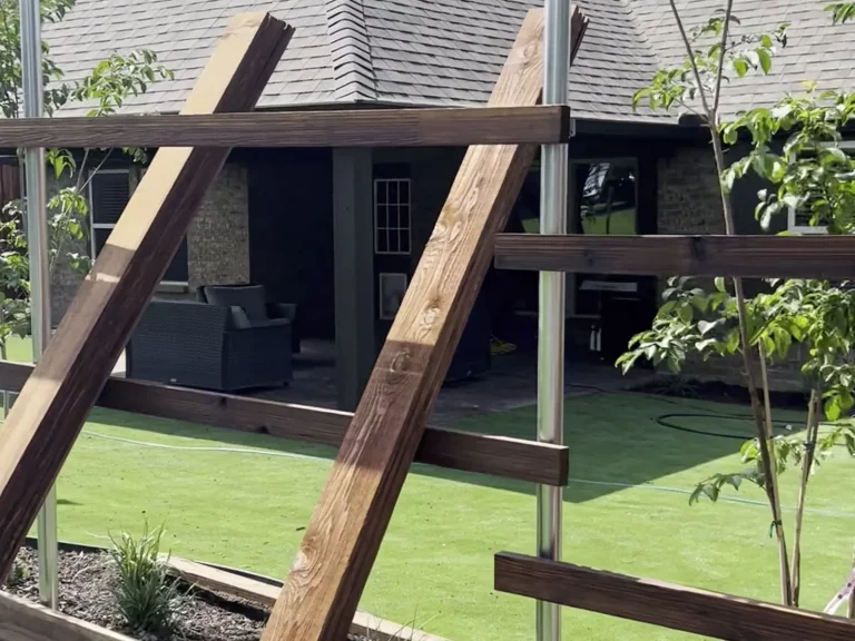 Steel post and cedar rail frame going up for a board on board fence in Fort Worth, TX