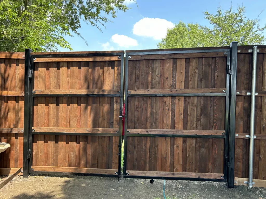 New double gate with cedar infill on a privacy fence in Mansfield, TX