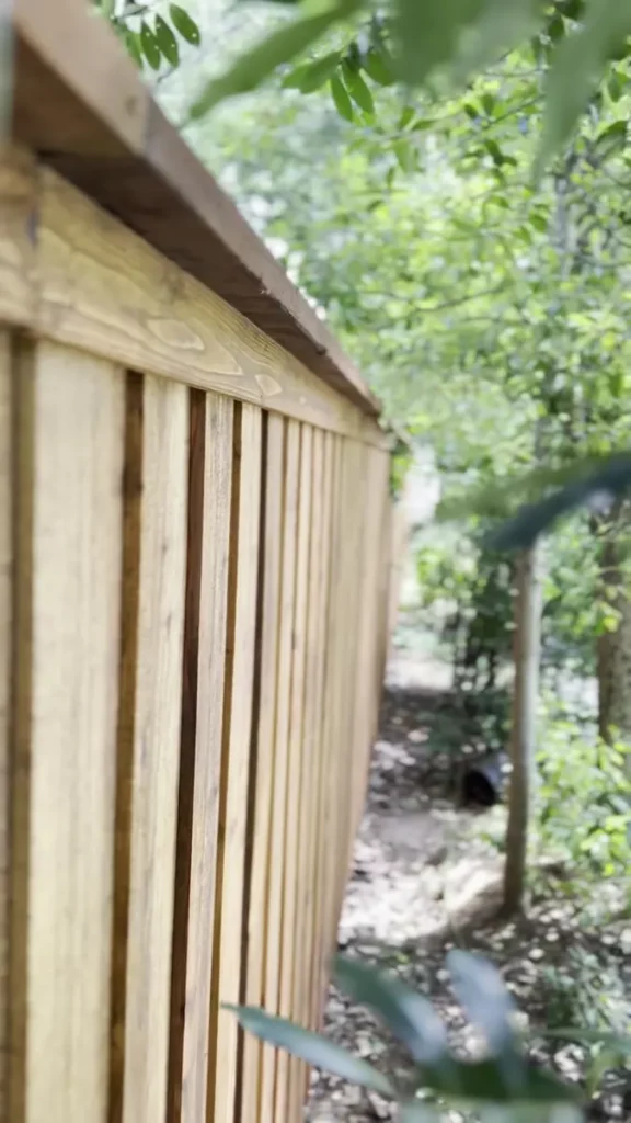 Cedar cap and trim detail on a board-on-board fence in Southlake, TX