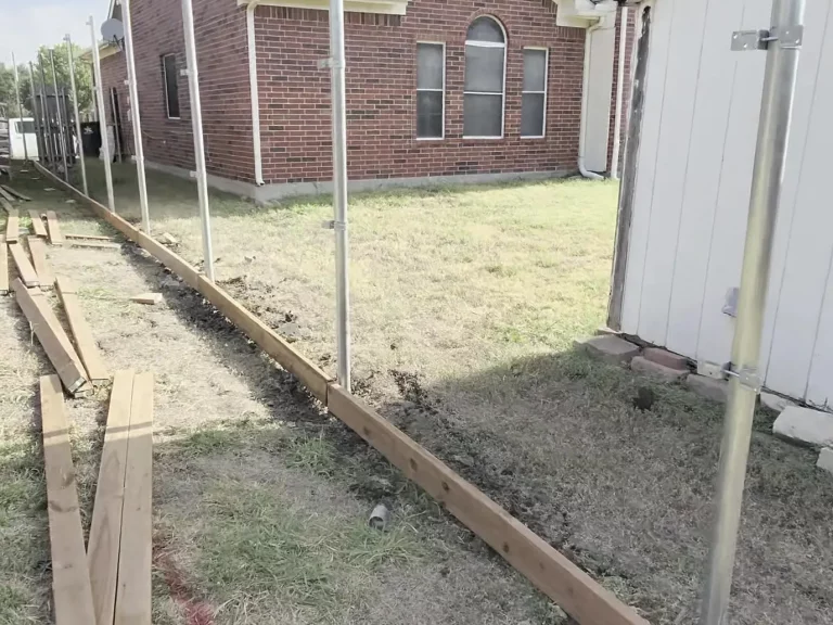 Side yard fence run staged by a cedar fence contractor in Arlington, TX