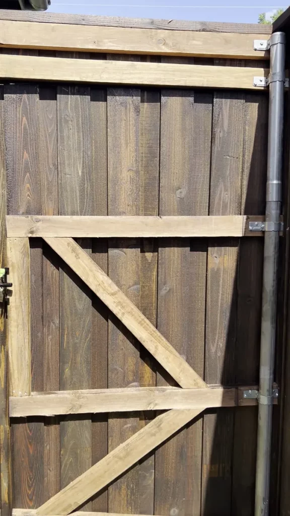 Cedar gate with a diagonal Z-brace on a fence in Grand Prairie, TX