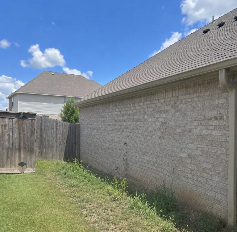 Cedar picket checked with a level during fence installation in Grand Prairie, TX