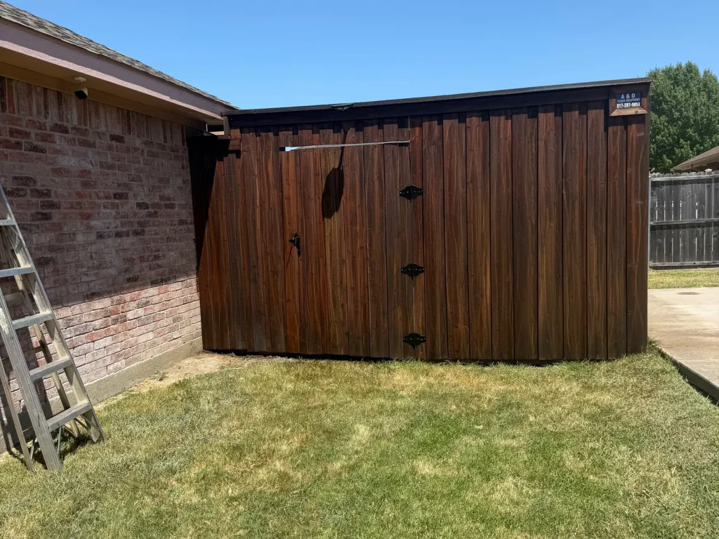 Double gate restained to match the fence line in DeSoto, TX
