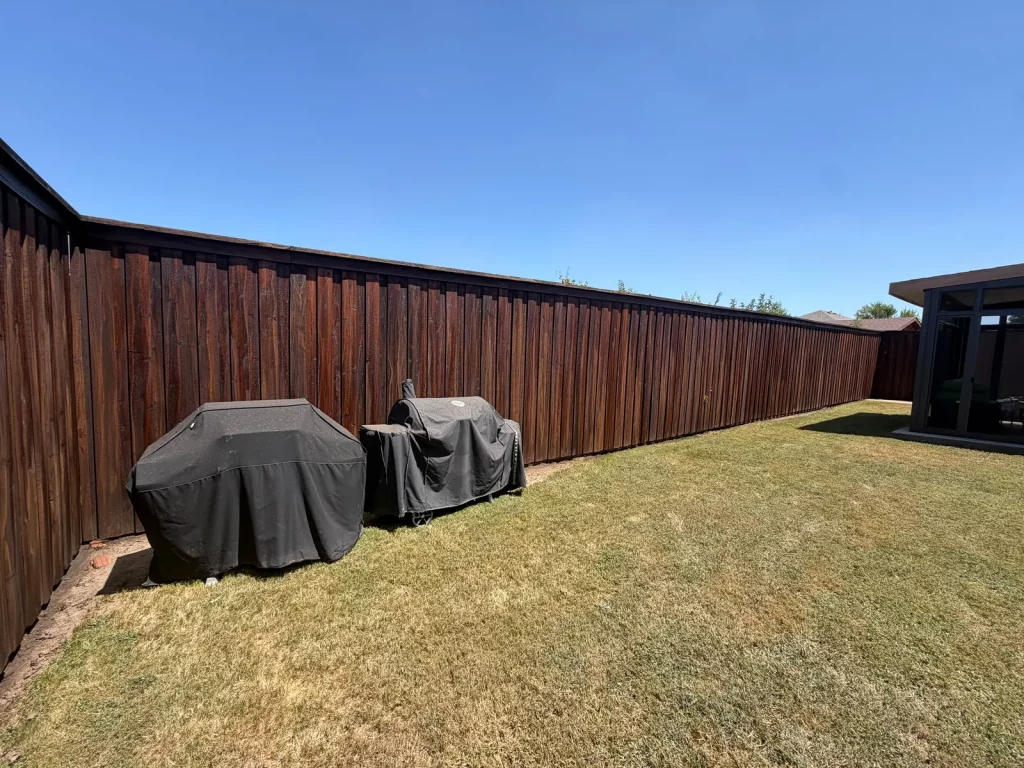 Completed fence staining in DeSoto, TX on 145 linear feet of 8 ft board on board fence