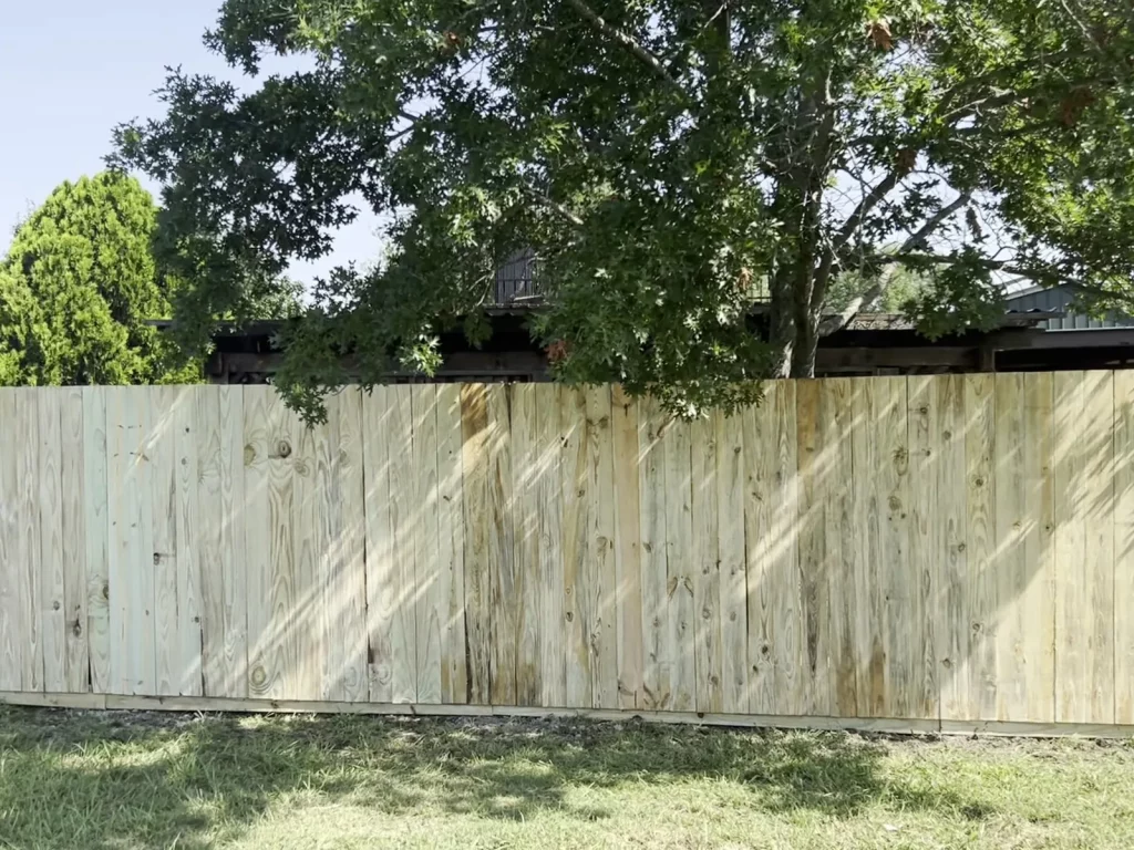 Wood privacy fence enclosing a backyard in Venus, TX viewed straight on from inside the property