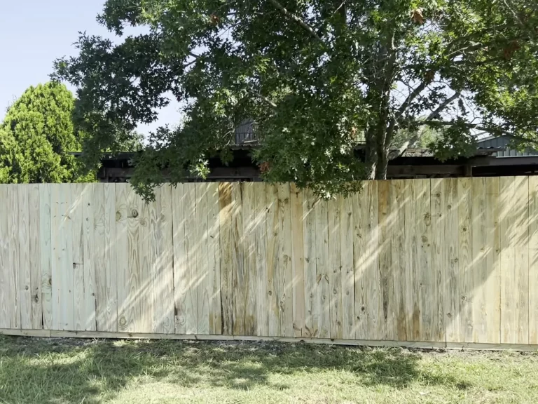 Wood privacy fence enclosing a backyard in Venus, TX viewed straight on from inside the property
