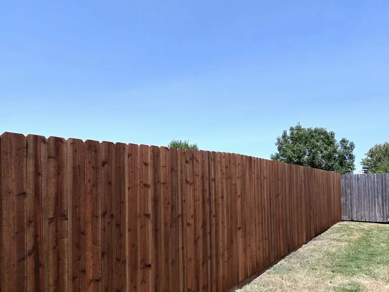 Finished tall cedar privacy fence with matching gate completed in Arlington, TX