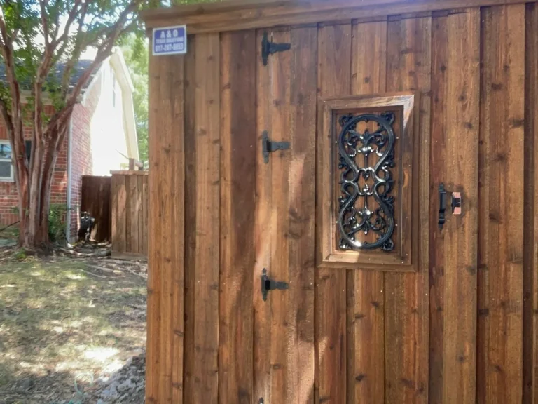 Repaired cedar fence section with a decorative diamond-lattice gate inset in Bedford, TX