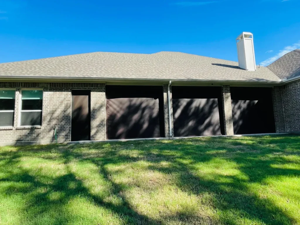 Three motorized patio screens in Celina, TX lowered across 10x10 openings on a covered patio